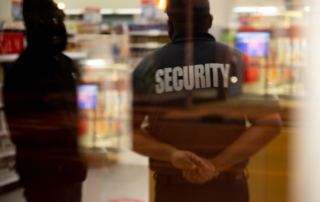 Executive protection officers standing inside a building