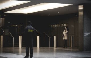 A security guard outside a building