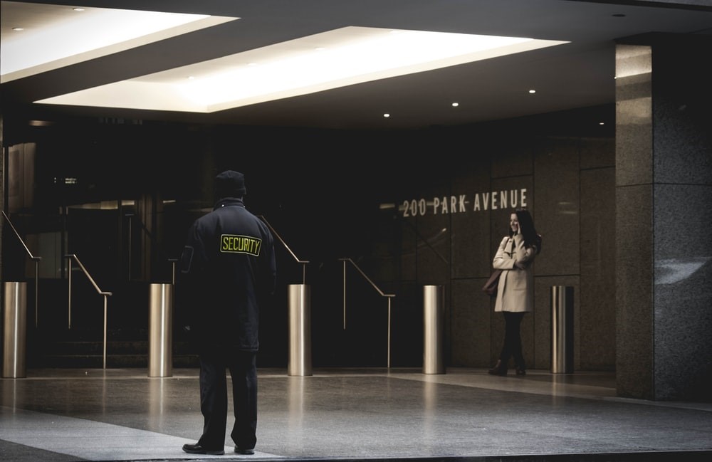 A security guard outside a building