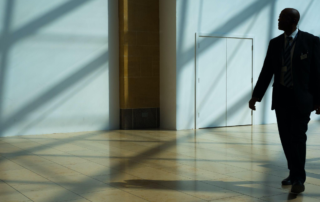 A security service employee checking a bank's building