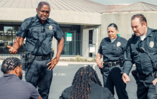 Off-duty police officers guarding celebrities against fans