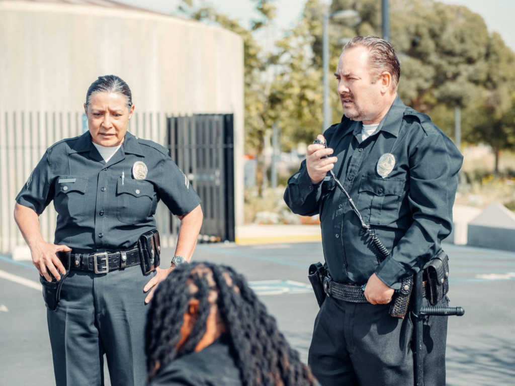 Two off-duty police officers guarding an organization