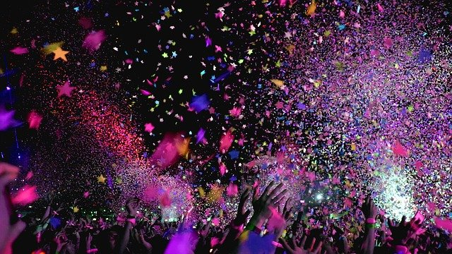 People throwing confetti during a community event in the US