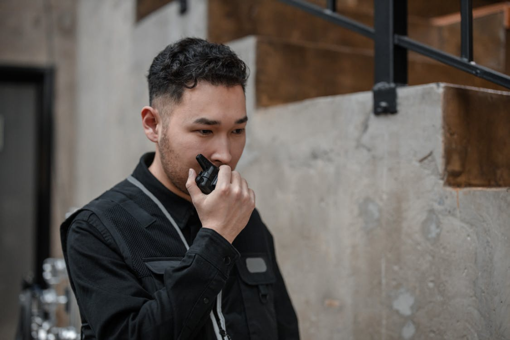  Security guard communicating on the walkie talkie