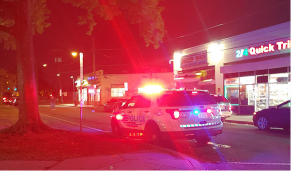 A security car patrolling near a hospital