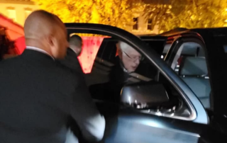 a person entering an automobile