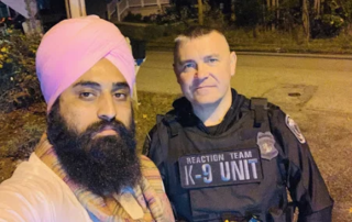 A person posing with a security officer