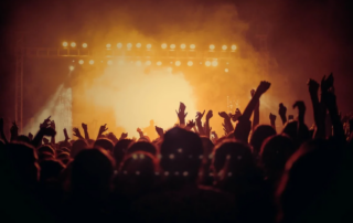 An image of a large crowd at a concert