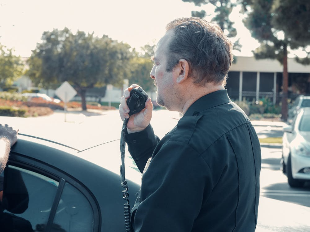 An image of a person speaking into a radio    