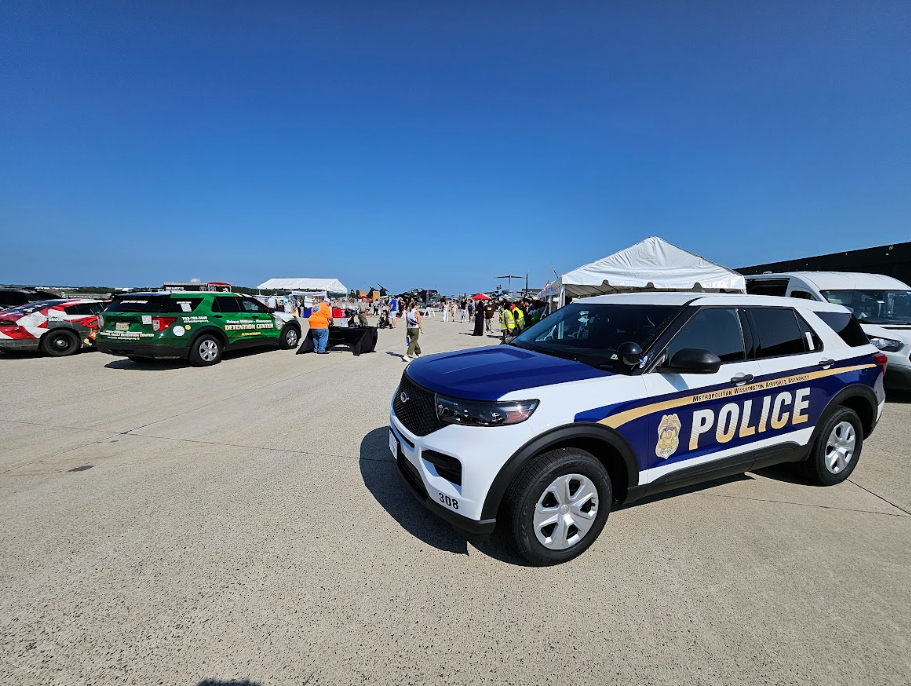 This image shows fans lining up outside the stadium as security teams coordinate entry points.
