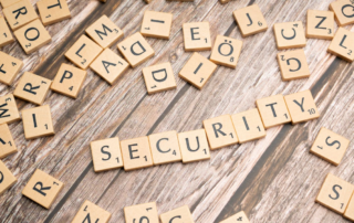 Word security is spelled out with scrabbled tiles.